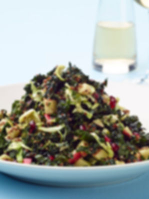 Kale, Quinoa & Brussels Sprout Salad with apples, almonds, pomegranate, and honey lemon vinaigrette