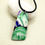 Thumbnail: Purple and Green Abstract Polymer Clay Pendant