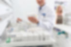 Pharmacist organizing medications_edited.jpg