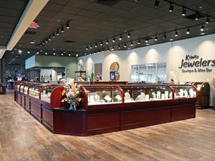 Jewelry cases filled with jewelry inside K. Hollis Jewelers located in Batavia, IL.