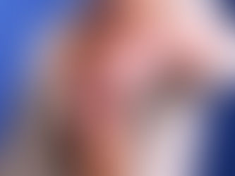 Close up of a solitaire radiant engagement ring set in yellow gold with a thick band and four prong setting.