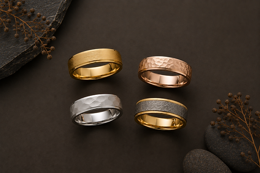A finished custom engagement ring next to its wax mold and sketches