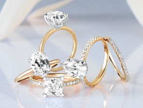 2026 ring trends collection showcasing modern engagement styles. The image features a selection of 14K yellow gold rings with white gold prongs, highlighting popular diamond shapes for 2026—including round, oval, pear, and princess cuts—set in solitaire and pavé bands that blend timeless elegance with contemporary design.