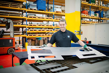 Boxford employee lase cuttng componnts to make a Boxford machine