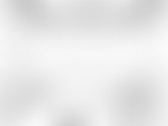 An empty conference room with a binder and coffee mug on the table.