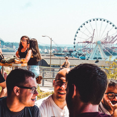 People gathered on the patio overlooking the carousel