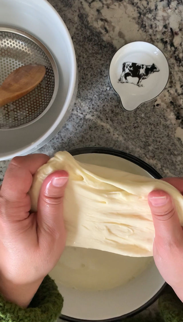 Mozzarella being stretched