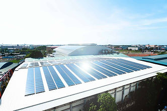 Commercial-solar-panels-on-top-of-a-commercial-building.jpg