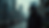 Close-up view of a masked figure silhouetted against a blurred cityscape