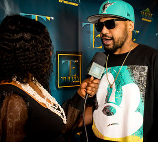macckmall being interviewed at theria entertainment event