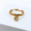 Miniature : Bague ajustable fait main en acier inoxydable doré avec un petit médaillon en zirconium.