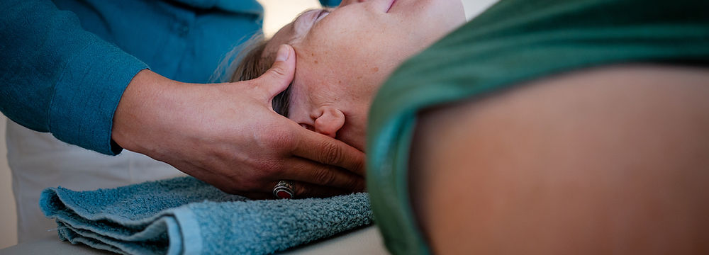 A woman receiving Bowen Therapy for TMJ
