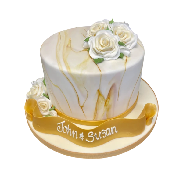 Elegant ivory and gold marble cake with intricate design, perfect for special occasions and celebrations. A stunning centerpiece for any event.