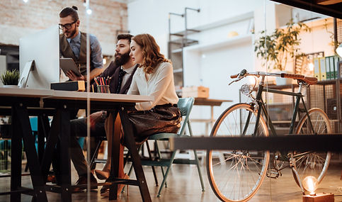 A woman sitting beside a man during a business meeting