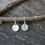Thumbnail: Tiny hammered sterling silver disc dangle earrings