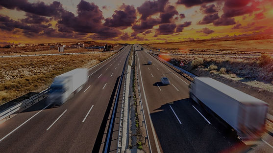 two way highway with cars driving on it