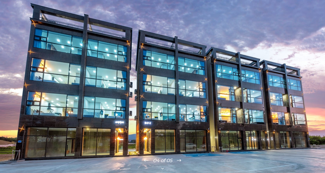 outdoor view of pension, 4 stories and lots of large windows