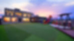 spacious outdoor grass and play area with slide at Dream Kids Pool Villa