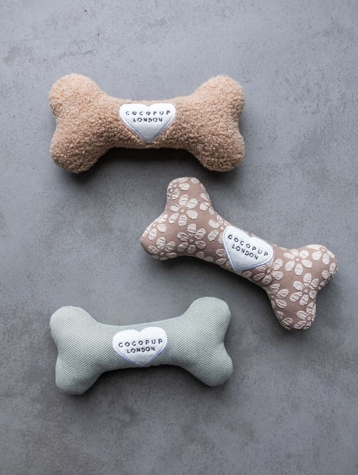Plush bone-shaped goldendoodle puppy essentials toys.