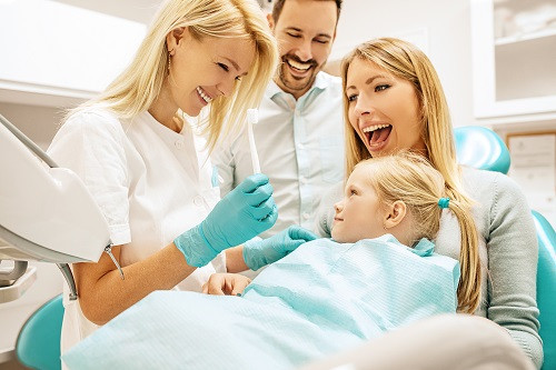 Parents with daughter at dentist