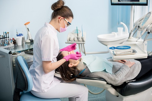 Dentist working on patient’s teeth