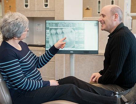 Dr. Lorscheider listens to his patients