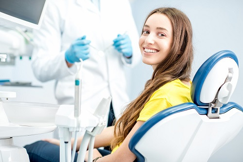 Female patient smiling in dental chair