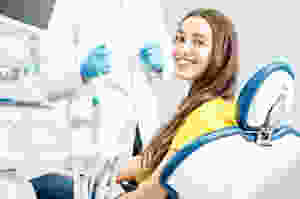 Female patient smiling in dental chair