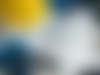 Conceptual flat lay featuring a napkin sketch of a human brain merging with digital circuits, surrounded by a yellow hard hat, submarine models, a Seabees patch, and computer chips.