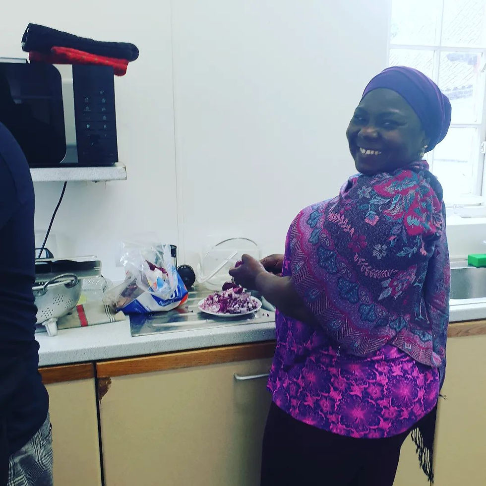 Photo: Sumeyhat working in the kitchen (image courtesy of The Zainab Project)