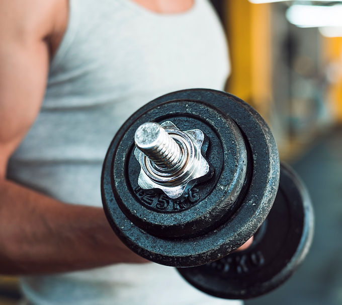 close-up-man-s-hand-doing-exercise-with-dumbbells.jpg