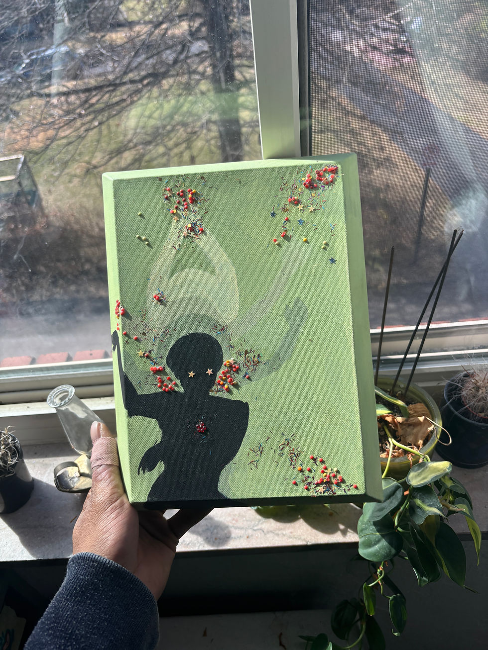 green background with black figure with glitter and gems