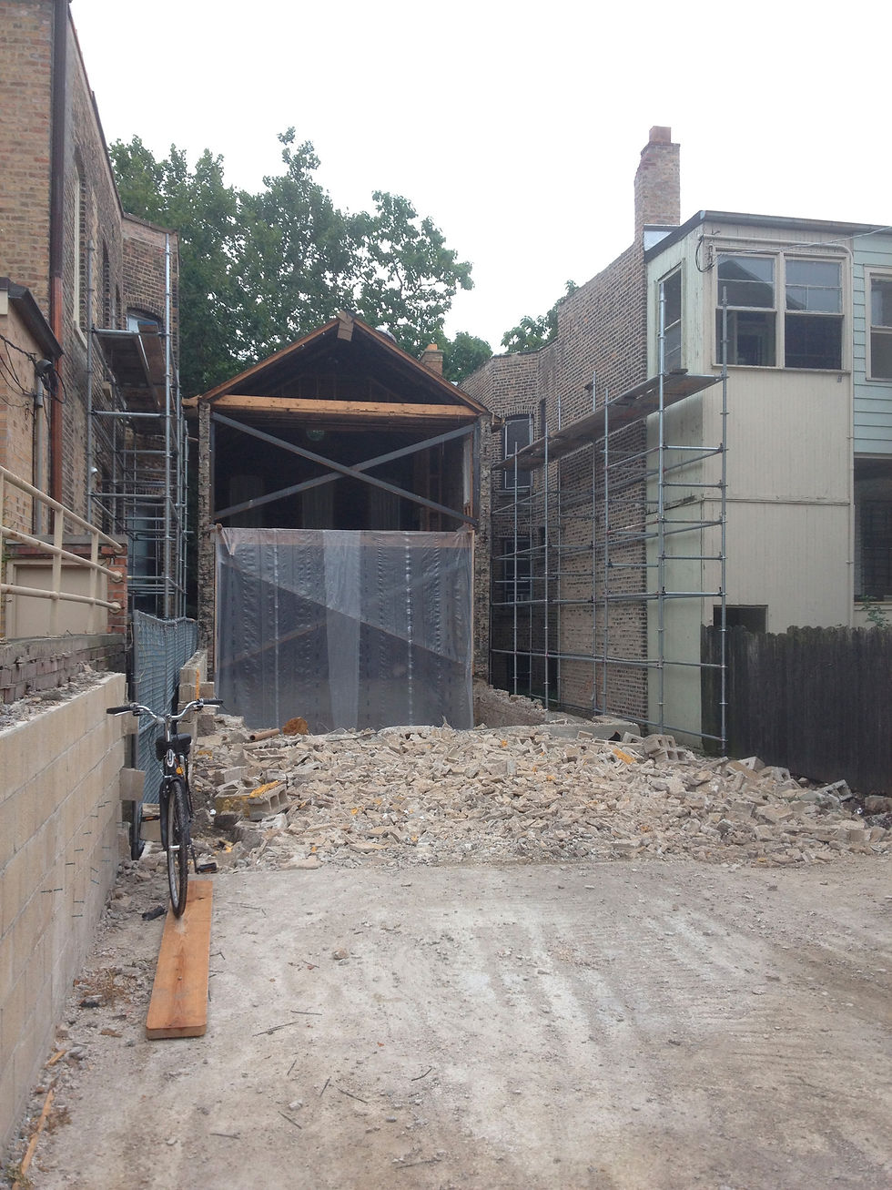The original walls from the 1890s, braced during demolition and reconstruction. / Photo: Aaron Gang