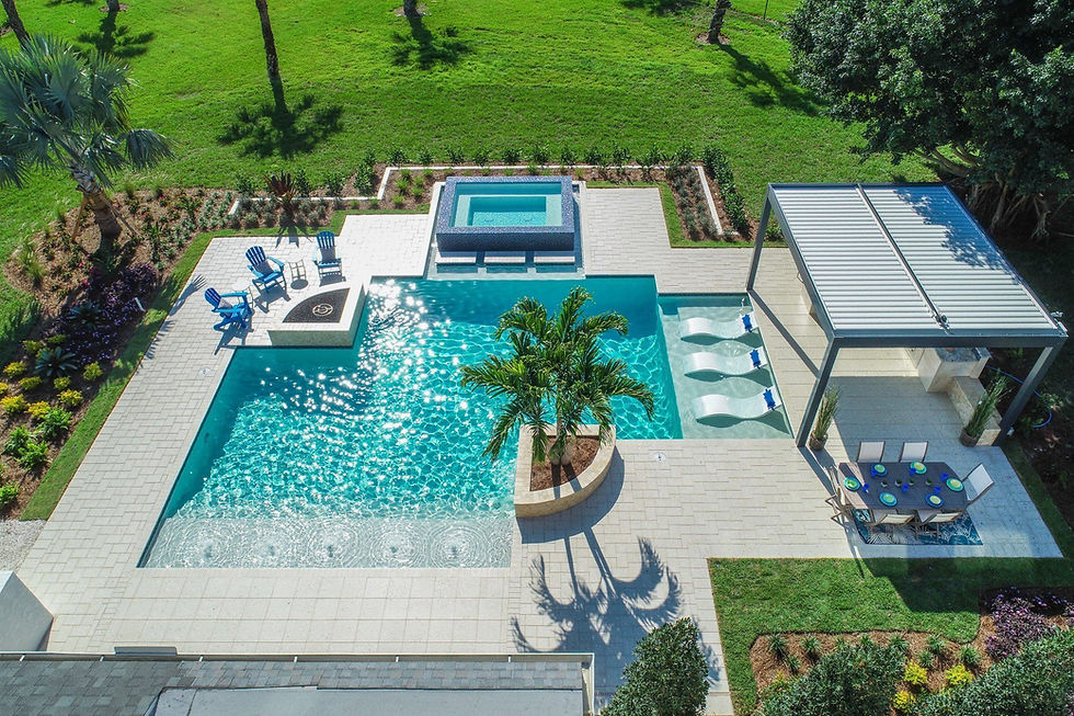 Modern backyard with a custom swimming pool, spa, outdoor kitchen, and landscaped design showcasing added home value.