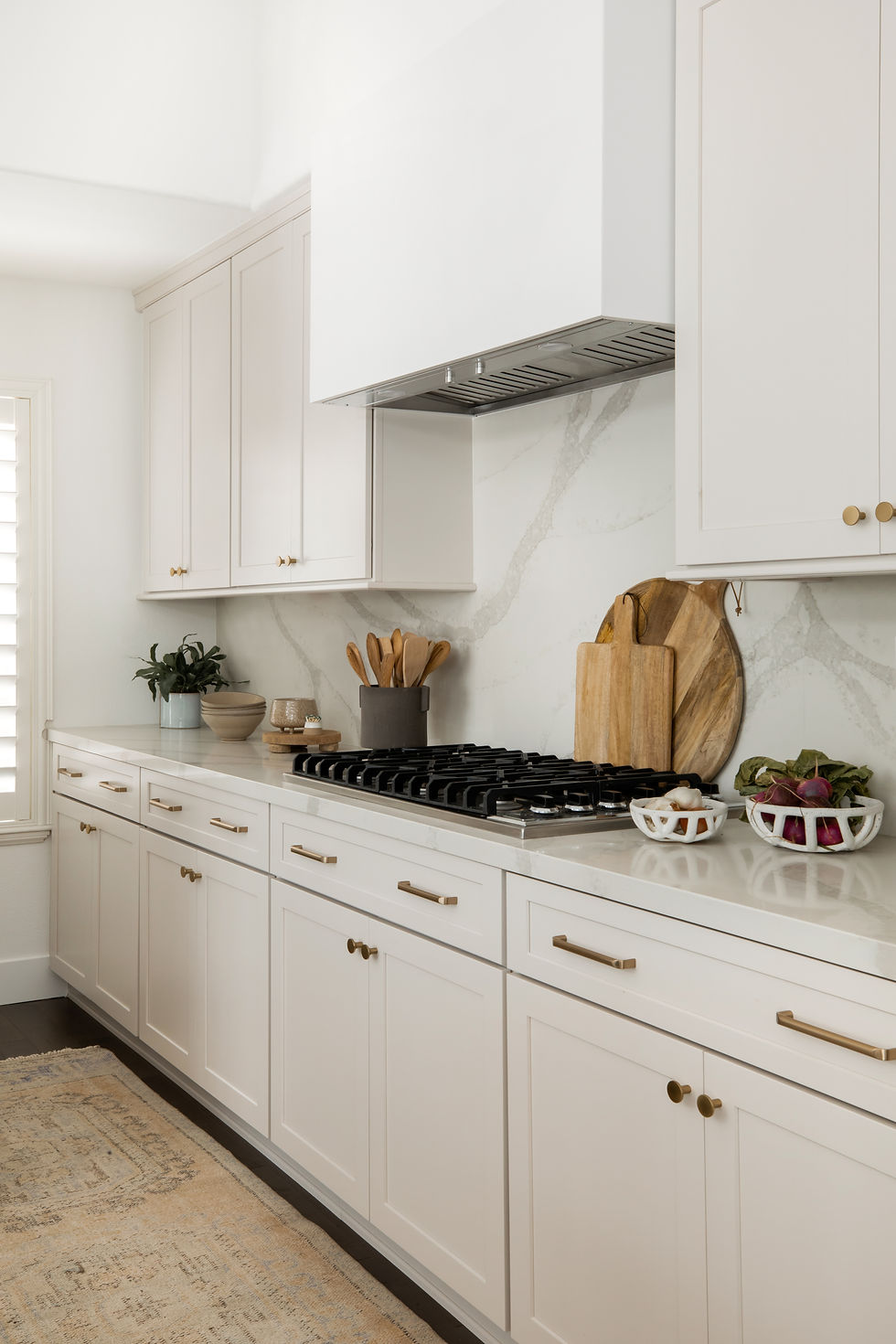 greige kitchen with quartz counters by Lindsey Brooke Design