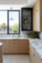 kitchen with marble and white oak cabinets but Lindsey Brooke Design
