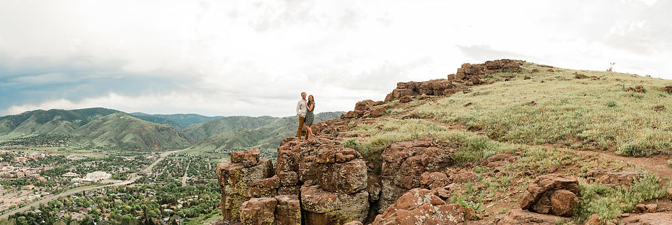Couple pose in front of foothills in Golden, CO