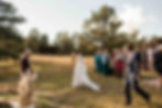 The bride and groom approach the outdoor altar together at the Ranchstead Inn in Allenspark, CO