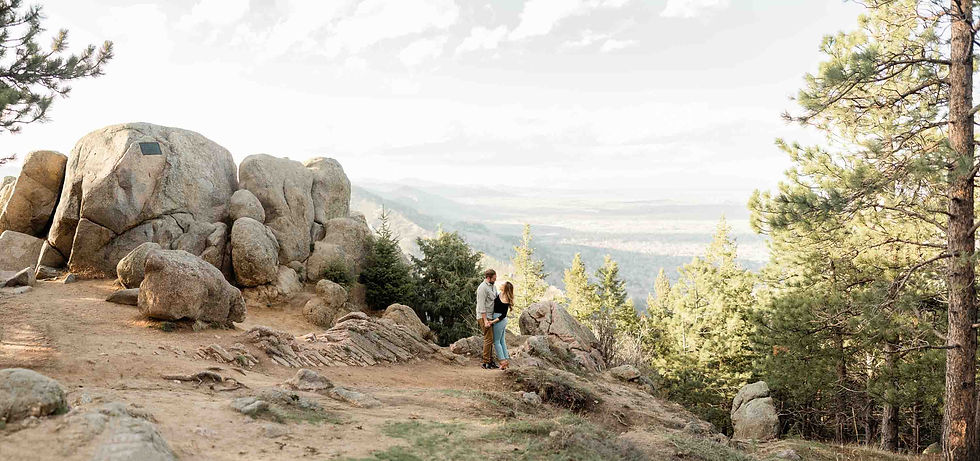 Couple pose at Lost Gulch overlook during engagement session in Boulder, CO