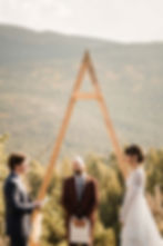 The groom reads his vows aloud at the outdoor altar at the Ranchstead Inn in Allenspark, CO