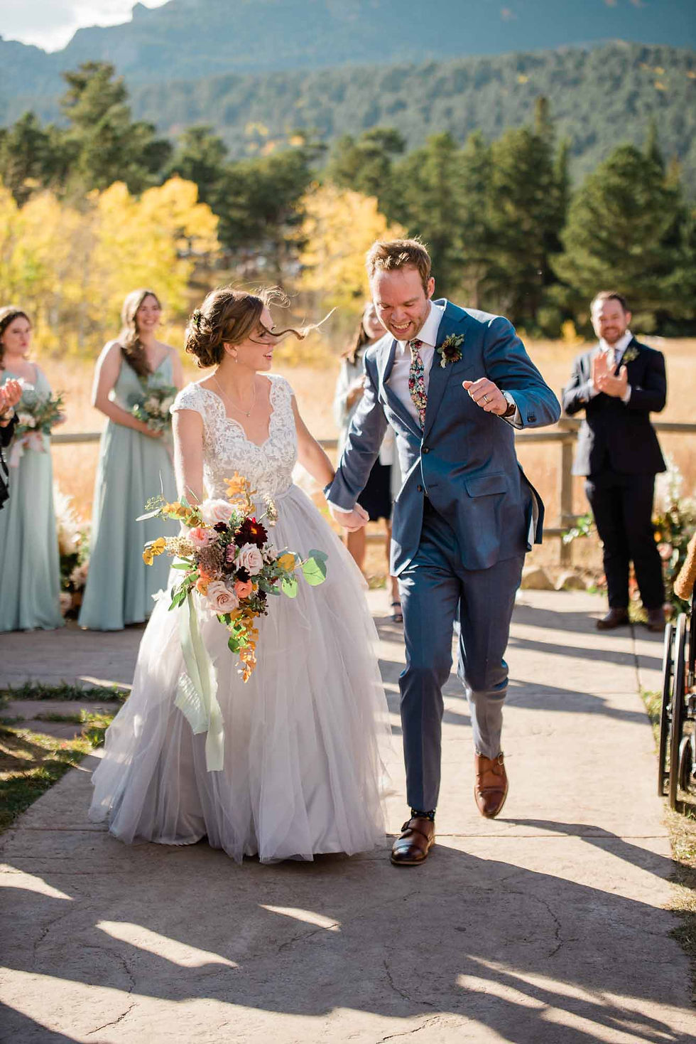 Bride and groom walk down the aisle
