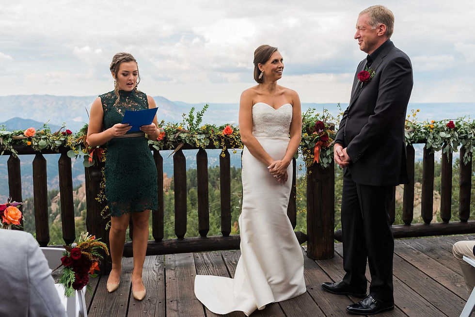 The bride and groom stand at the altar together at Cloud Camp at the Broadmoor