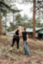 Man and woman kiss while holding archery bow and arrows