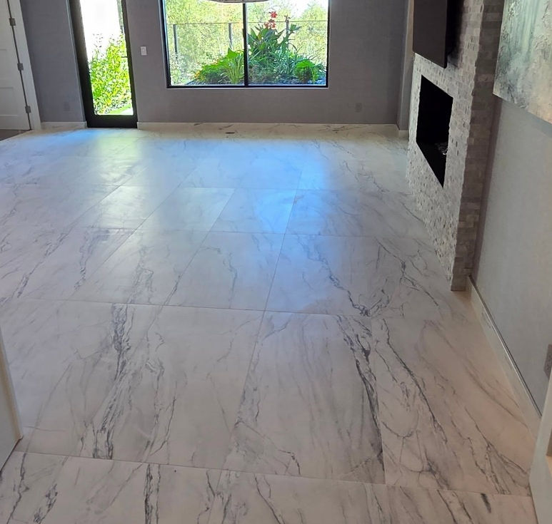 marble look tile flooring Phoenix AZ in living room with fireplace
