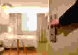 Someone opening a bedroom door.