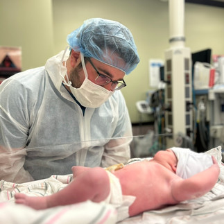 Dad Looking at Baby Sophia - Chelsea Schmidt's Birth