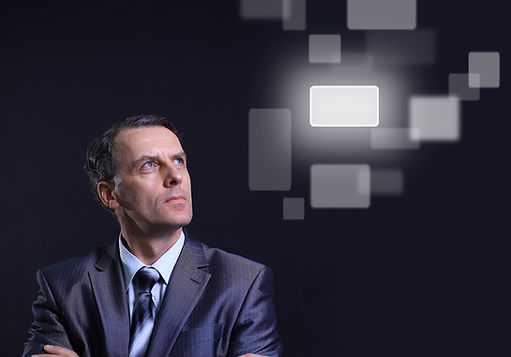 Man in suit and tie staring into distanc