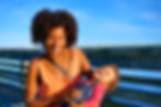 smiling woman holding smiling baby