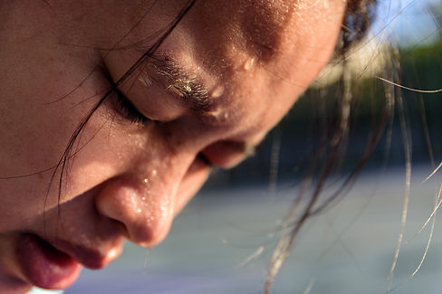 Closeup of sweating water drop on face asian woman. Sport female exercise in fitness..jpg