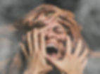 Hands, face and woman abuse victim with fear, mental health and pain scared with smoke. Cr